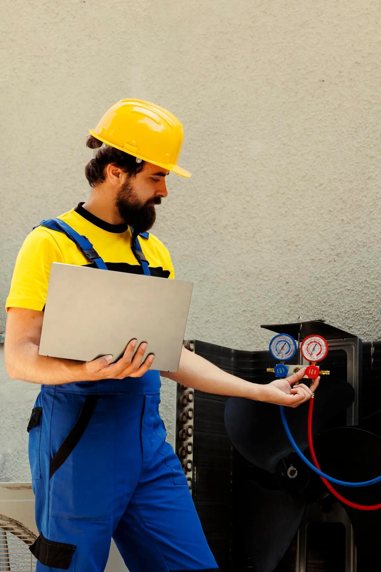 A mechanic calibrating a pressure device